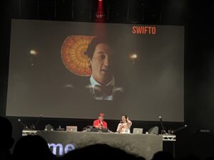Screens playing Taylor Swift music videos